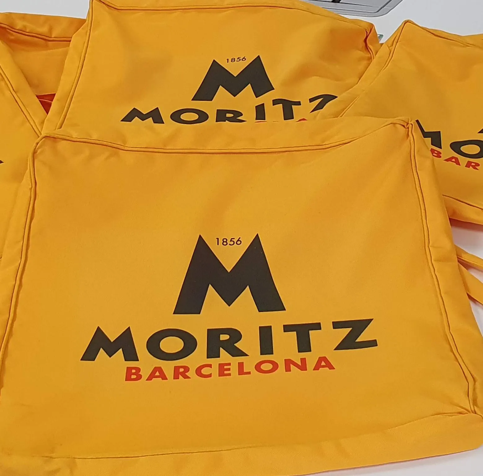 Custom printed aprons with a client logo from BPM Print Manchester